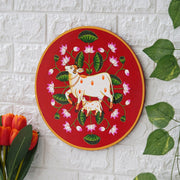 This beautiful pichwai painting features a mother cow and her calf, a timeless symbol of nurturing love.
