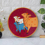 Load image into Gallery viewer, Crafted on a wooden plate, this pichwai portrays three cows in a circular formation.
