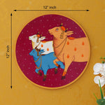 Load image into Gallery viewer, Crafted on a wooden plate, this pichwai portrays three cows in a circular formation.
