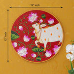 Load image into Gallery viewer, This beautiful pichwai painting features a serene white cow adorned with a vibrant floral headdress.

